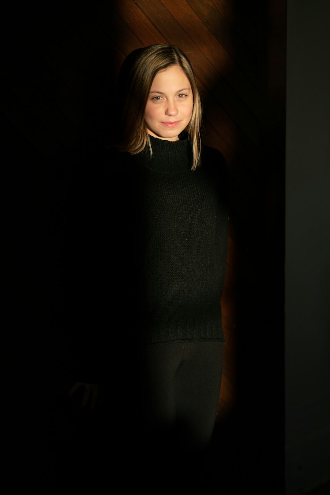 Studio portrait of a Swiss television presenter holding a microphone